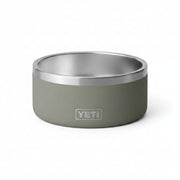 A YETI insulated pet bowl with a matte sage green exterior and a brushed stainless steel interior, shown on a clean white background.